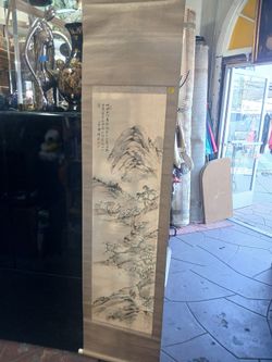 Asian hanging scroll painting featuring a landscape scene.