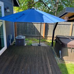 Outdoor umbrella with weights for base