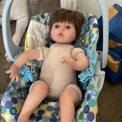 reborn doll and car seat