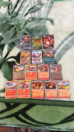A bunch of Charizard, Charmeleon Pokemon cards