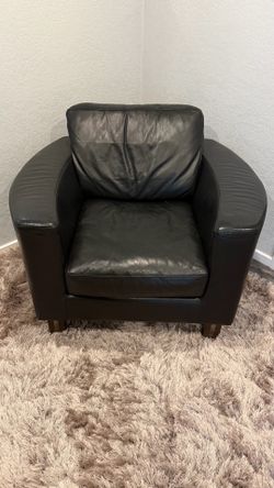Real leather black Natuzzi chair