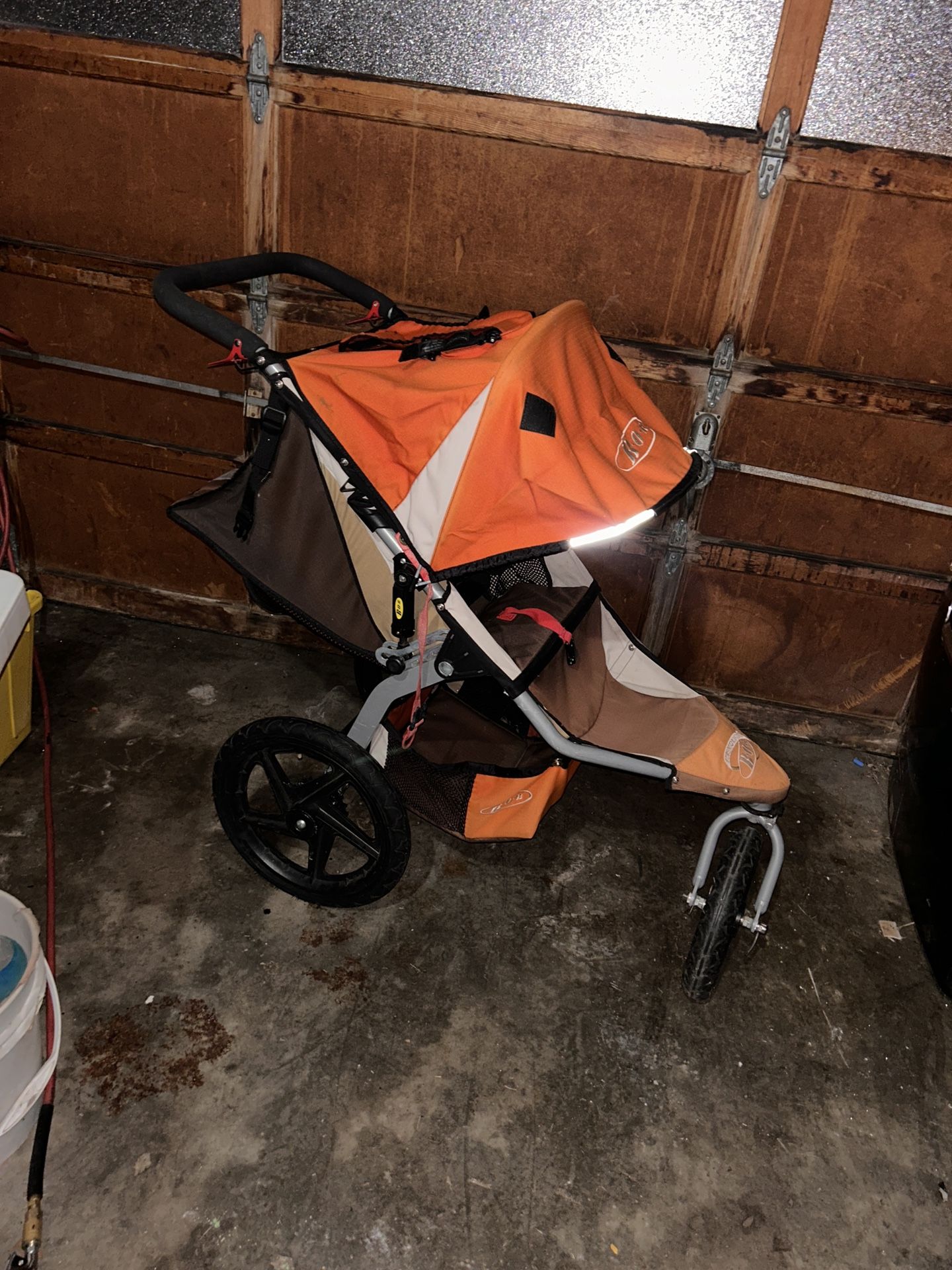 BOB STROLLER ORANGE SINGLE SWIVEL 