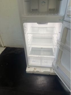 A moving sale: Like-New Frigidaire Apartment-Size Refrigerator with Top Freezer