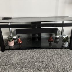 Free Glass TV stand (fits up to 75’) and Free Leather sofa.