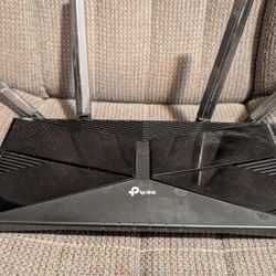 TP Link Router Has Multiple Steps For Corded In Wire Lines Also Has Wi-Fi Because Wi-Fi 6 And 5 Capabilities Speed Is Volume 1800 Gigs