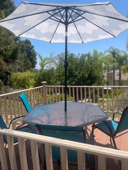 Patio set, 4 new chair, and umbrella