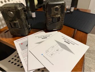 TWO BRAND NEW CAMO TRAIL CAMS
