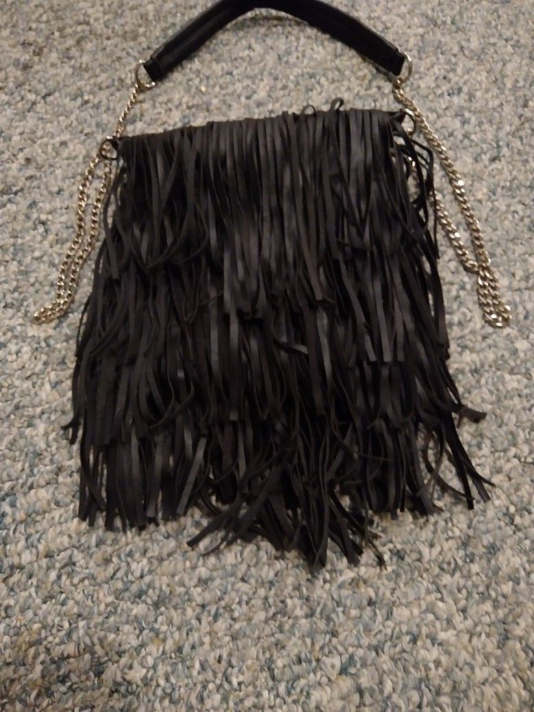 BLACK. FRINGE PURSE WITH SHOLDER CHAIN STRAP ITS ABOUT 10 BY 10. INCHES. GOOD FOR BIKE RALLY