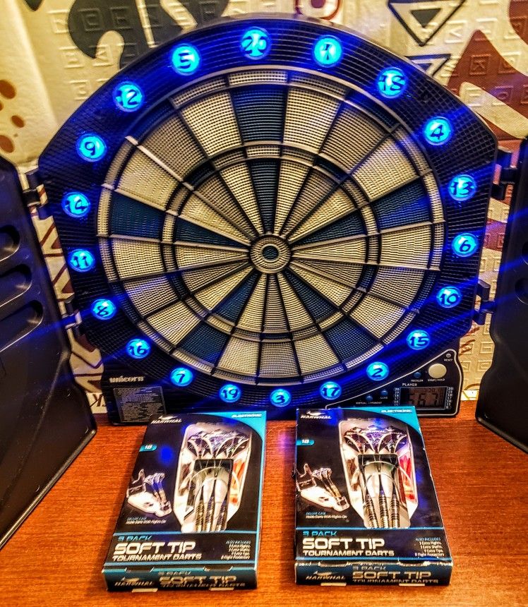 Unicorn Electric Speaking Dart Board With Cabinet Protecting Shelves LED Lighting 1000 Games To Play & 2 New Sets Of 3 Soft Tips Darts New