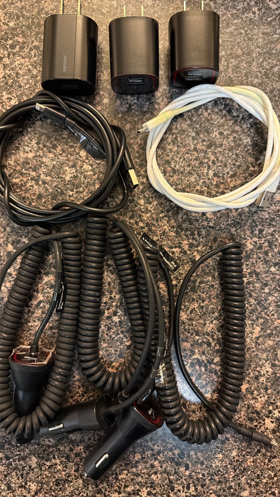 Verizon Black USB Charging Blocks(3), 6ft. black USB to Micro USB cable(1), 4ft. white USB to Micro USB cable(1), and Micro USB car chargers(3)