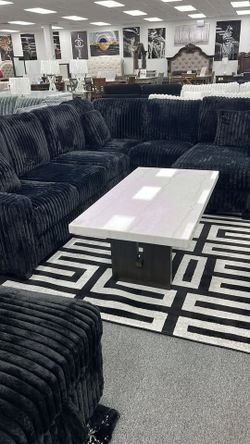 Elevate your living space with this Luxurious black sectional