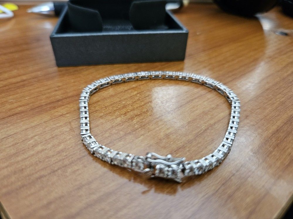 Moissanite Tennis Bracelet 3MM 6.5inches. Stamped 925 Sterling Silver. Passes diamond tester.