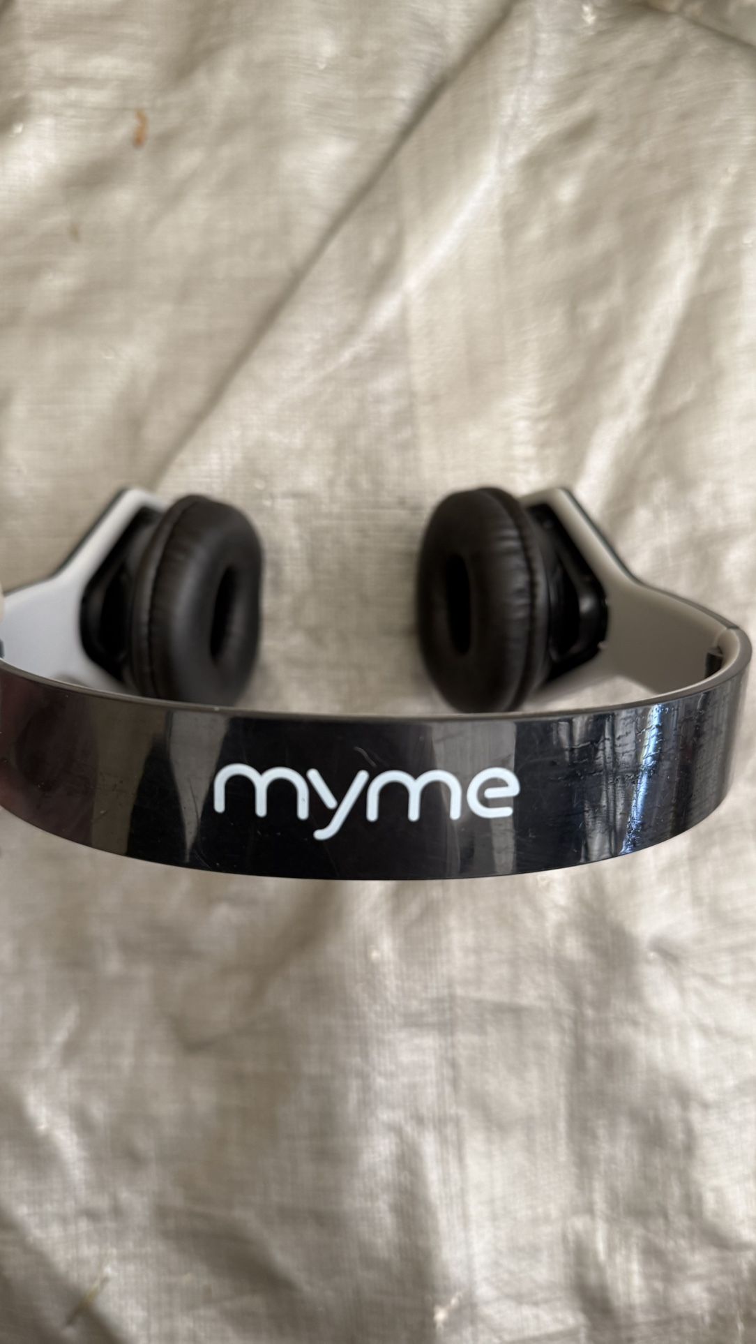 MyMe Wireless Headphones β Black & White Comfortable over-ear wireless headphones by MyMe. Sleek black and white design with cushioned ear pads and a