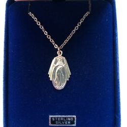Sterling Silver Miraculous Medal on an 18 inch stainless steel chain. Sacred Heart of Jesus also depicted on front of this Medal. Religious jewelry.