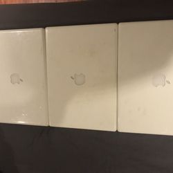 Three Apple laptops for parts