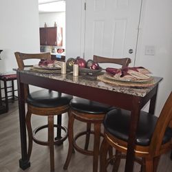 SMALL DINNING TABLE,  3  TALL BARSTOOLS AND 2 SHORT STOOLS