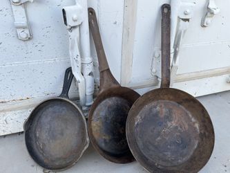 Three Cast-Iron Skillets