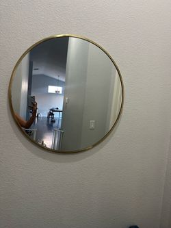Gold round mirror