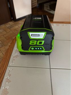 Lawnmower battery, and charger