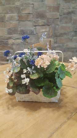 Decorative basket of flowers artificial
