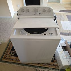 Washer Whirlpool.  Works Fine Except Leaves White Detergent Stain Due To Build Up