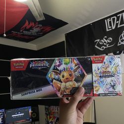 Pokemon Prismatic Evolutions Surprise Box + Booster Bundle