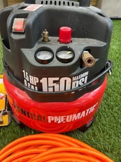 Small pancake air, compressor with hoses and nailer gun