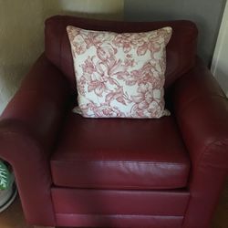 Red leather chair . Super comfortable. Leather is great for kids and pets. Redecorating