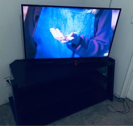 Toshiba fire TV edition 43 inch With box and Glass top entertainment center Original Owner in Great working & Looking condition