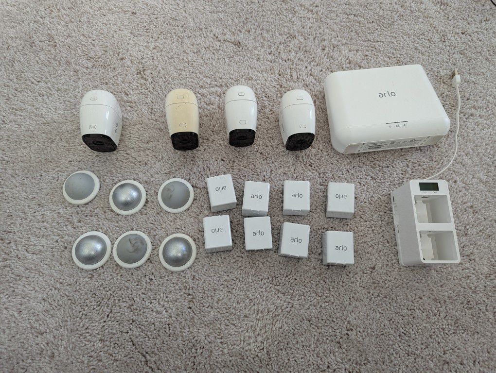 4 Arlo Pro W/ 8 Batteries, Charger And Base