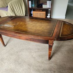 Oval Shaped Antique Coffee Table with Leather Top and Folding Leafs and Casters