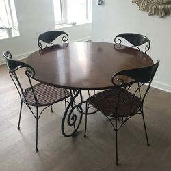 Mahogany Table With Rod Iron Chairs With Cane Seating