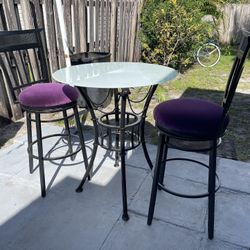 Two Metal Swivel (Bar Stools 29”H To Seat Purple Fabric) And (Table 31”D X 351/2”H With White Glass) In Good Condition $70 Firm On Price