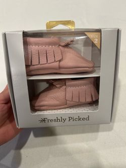 Baby girl freshly picked moccasins