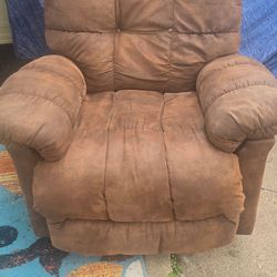 Brown suade RECLAIRNER CHAIR .40 in .tall 36 wide.