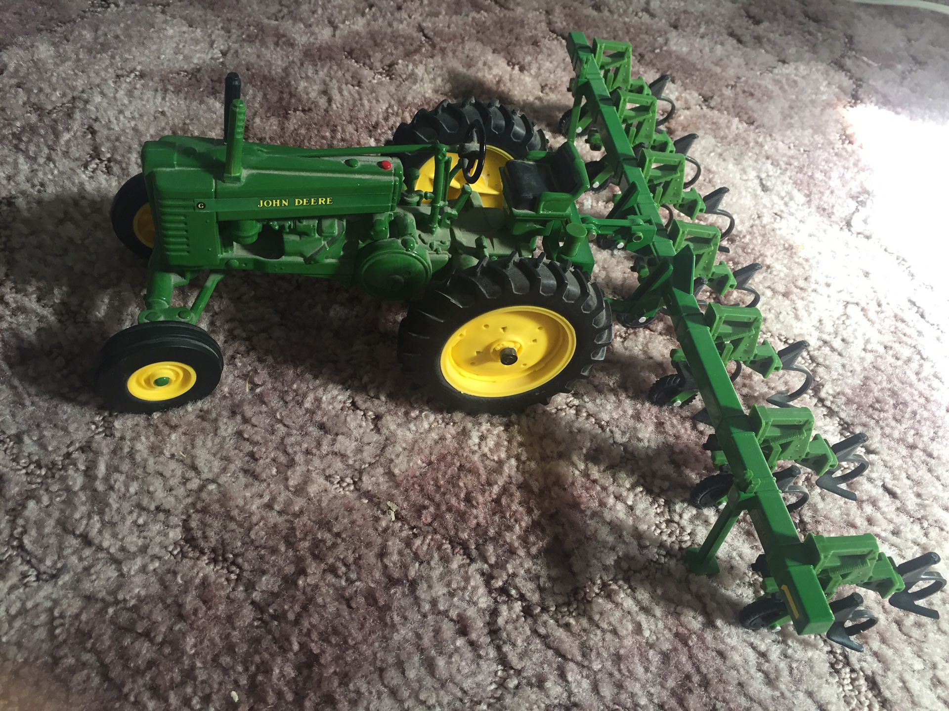Medal John Deer tractor with attachment