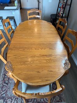 Large Oak Dining Table with 6 carved ladder back chairs - French Country style.