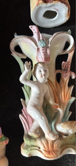 Antique Porcelain Cherub Figurine with Floral Detail