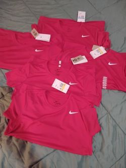 Five small and medium Dri-Fit Nike shirts for girls