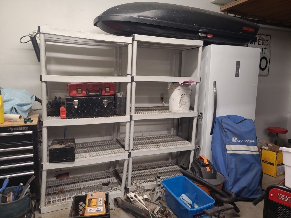 Two Free Gray Shelving 5 Shelf Units. Nothing On The Shelf Included