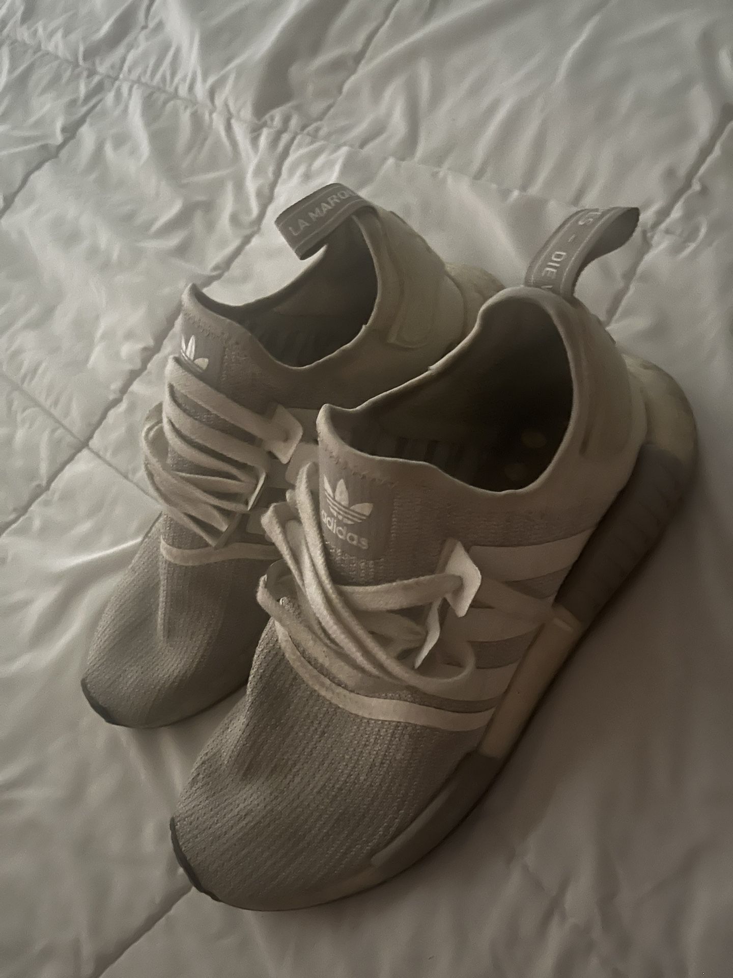 Gray and white adidas nmds