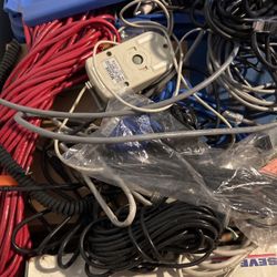 Box of computer cables, and the keyboard.
