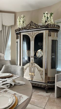 Guler Furniture Gloria China Cabinet features a bombé silhouette with champagne silver frames and