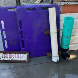 Two water troughs, two pig gates for feet two more feet and two pairs of boots