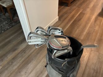 Golf clubs, Ram FX2 graphite forged irons, 3-PW with bag and two sand wedges and Adams 3 hybrid.