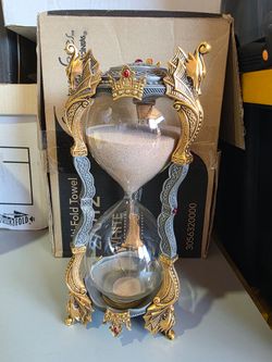 Franklin Mint Merlin's Crystal Hourglass, crafted with a 24-karat gold finish and inlaid with ruby red glass cabochons #J0949