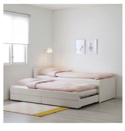 Ikea day bed with trundle bed and drawers.