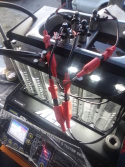 Injector cleaning and testing