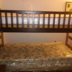 Wooden bunk bed with Mattresses still in Plastic covers