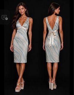 blue & white midi dress with open back and tie detail #party #eveningwear #formal